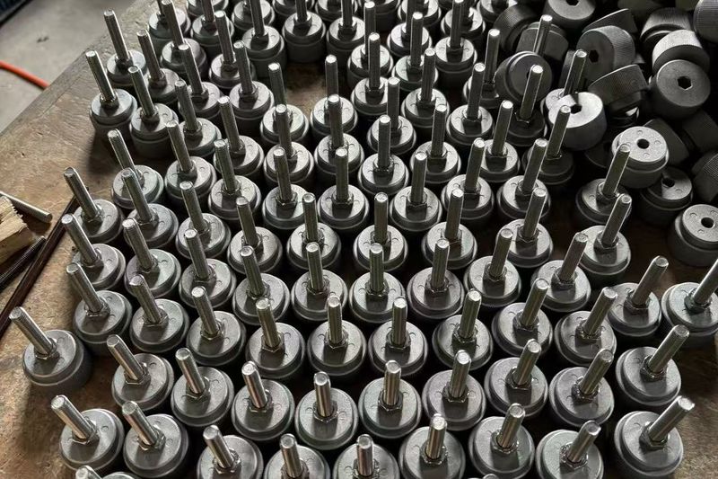Batch-turned aluminum parts before redesign