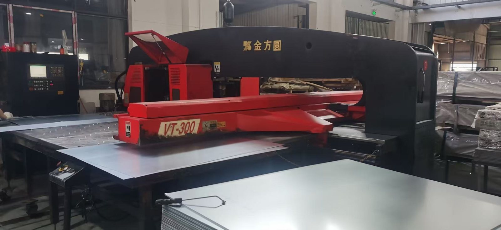 CNC turret punch press with sheet stock on the table